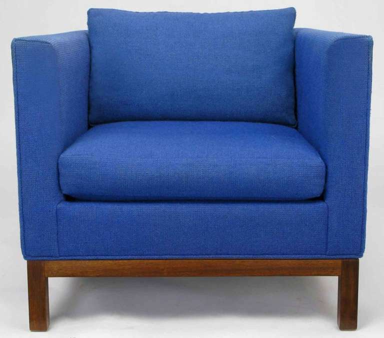 Very popular cube style club chair by Dunbar in the original blue wool upholstery with walnut Parson-style legs and apron. Loose seat and back cushions. Not certain if this is by Edward Wormley, or another Dunbar designer.

Measures: Seat height