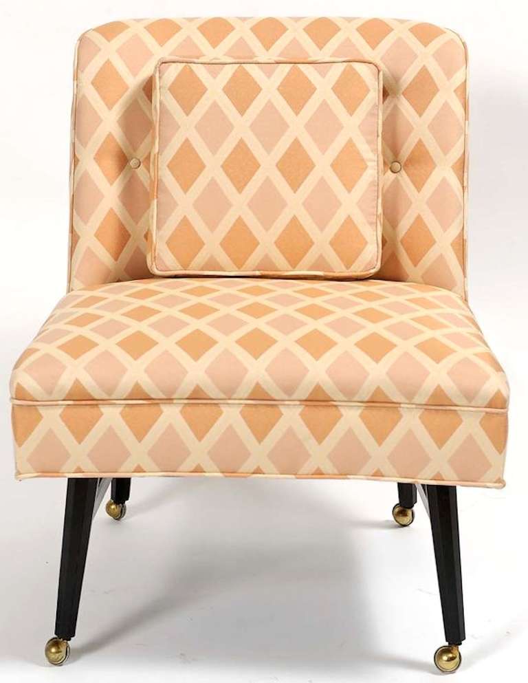 Set of four restored and reupholstered Harvey Probber low game table chairs.
Ebonized mahogany octagonal legs with original casters. Upholstered in a ecru based harlequin patterned apricot, creamy stawberry silk and linen blend fabric. Can be used