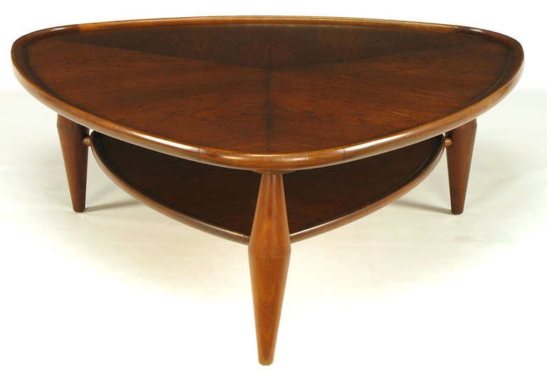 John Widdicomb parabolic triangle coffee table. Walnut parquetry top with raised edging and reduced second tier with same parquetry design. Turned solid walnut legs with center stretchers holing up the second tier.