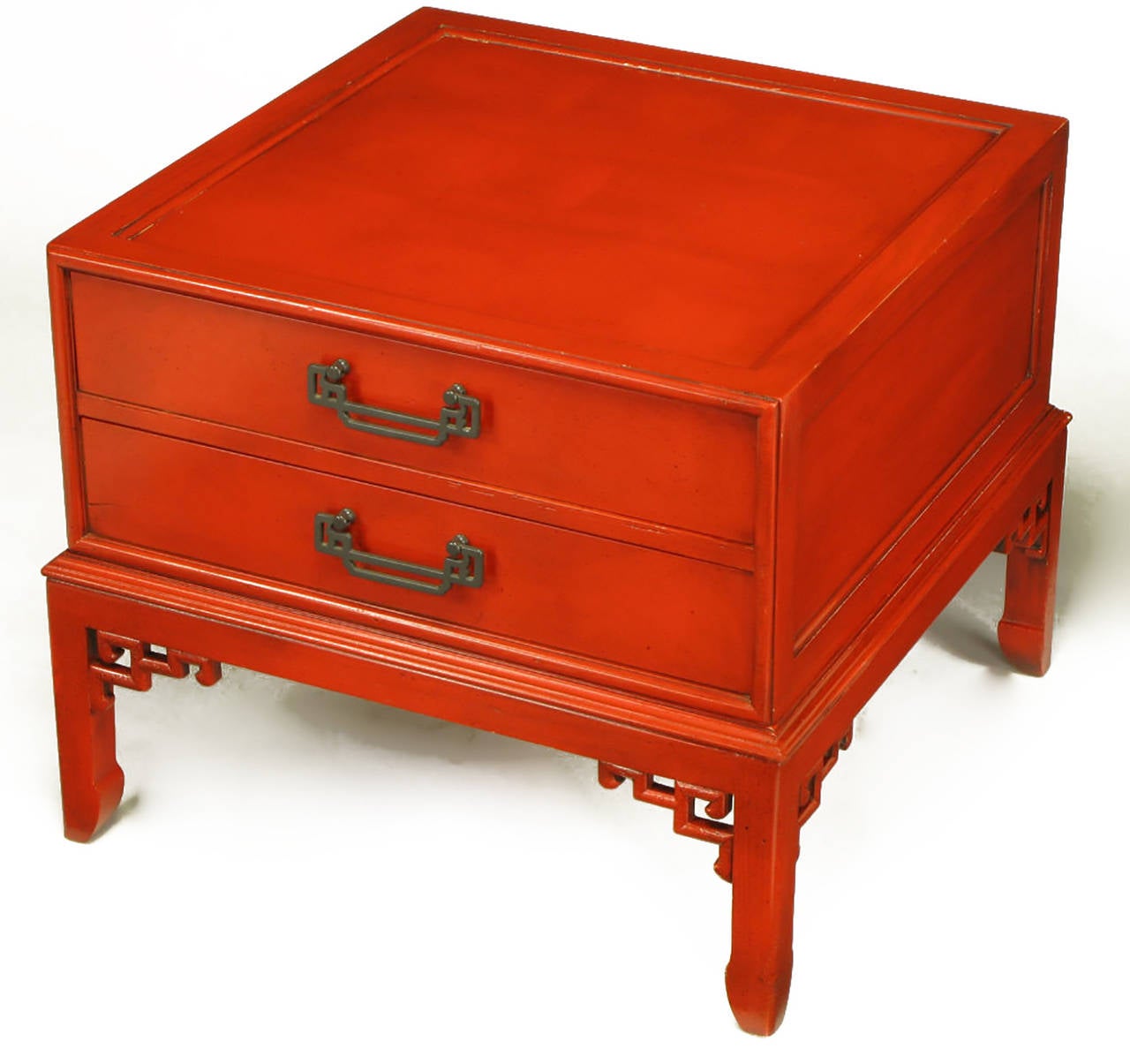 Hekman Furniture two-drawer side table in cinnabar lacquer with black glazed finish. Recessed top and the appearance of a two-drawer case mounted on a Ming style leg open fretwork and bracketed base. Patinated brass Asian form drop pulls.