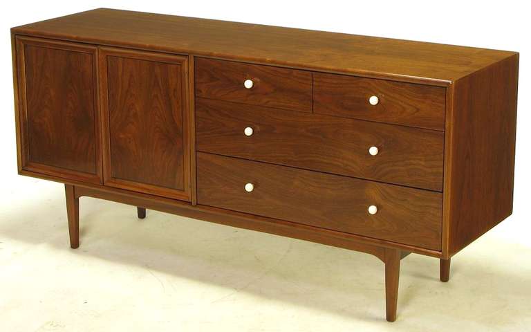 Restored to better than new condition, ten-drawer dresser by Kip Stewart and Stewart MacDougall for their Drexel Declaration collection. Four exposed drawers with original spherical porcelain knobs and brass spacers. Six more drawers are revealed
