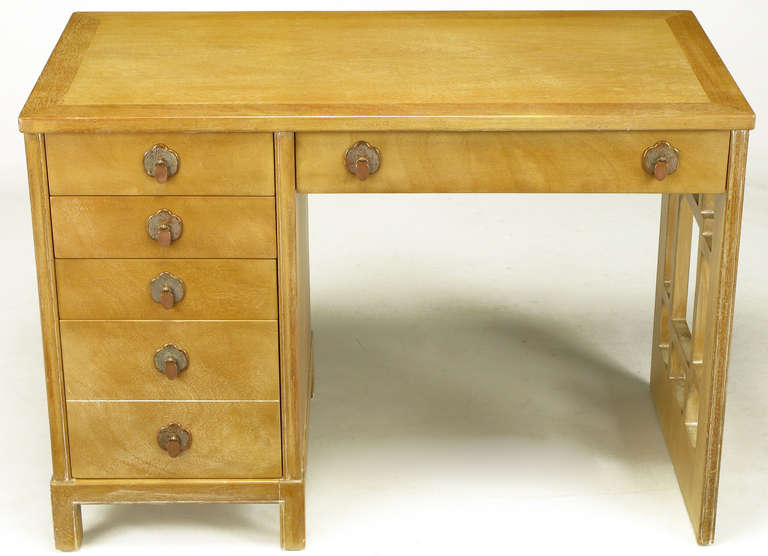 Landstrom furniture desk in bleached and limed mahogany. Aged nickel over copper drop disc pulls and trefoil escutcheons. Five drawers to the left, a single drawer above the opening and a latticed side support. Landstrom was a fine furniture maker