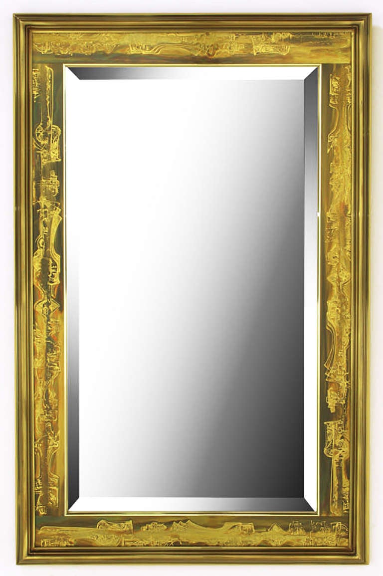 Beveled mirror with a Mastercraft, Bernhard Rohne designed acid etched panel and beveled solid brass frame. Backed by a gold lacquered wood panel.