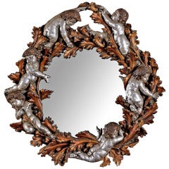Copper and Silver Leaf Round Mirror with Foliate and Putti Detail