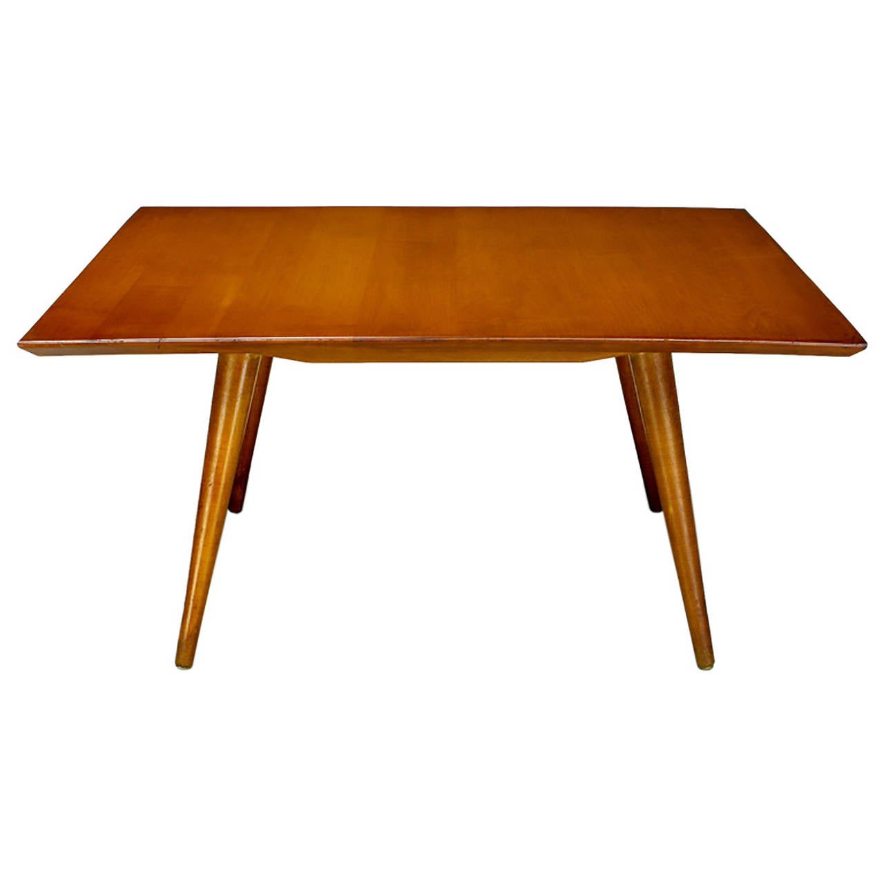 Clean-lined coffee table by Paul McCobb for Winchendon. Solid rock maple top with four conical legs.