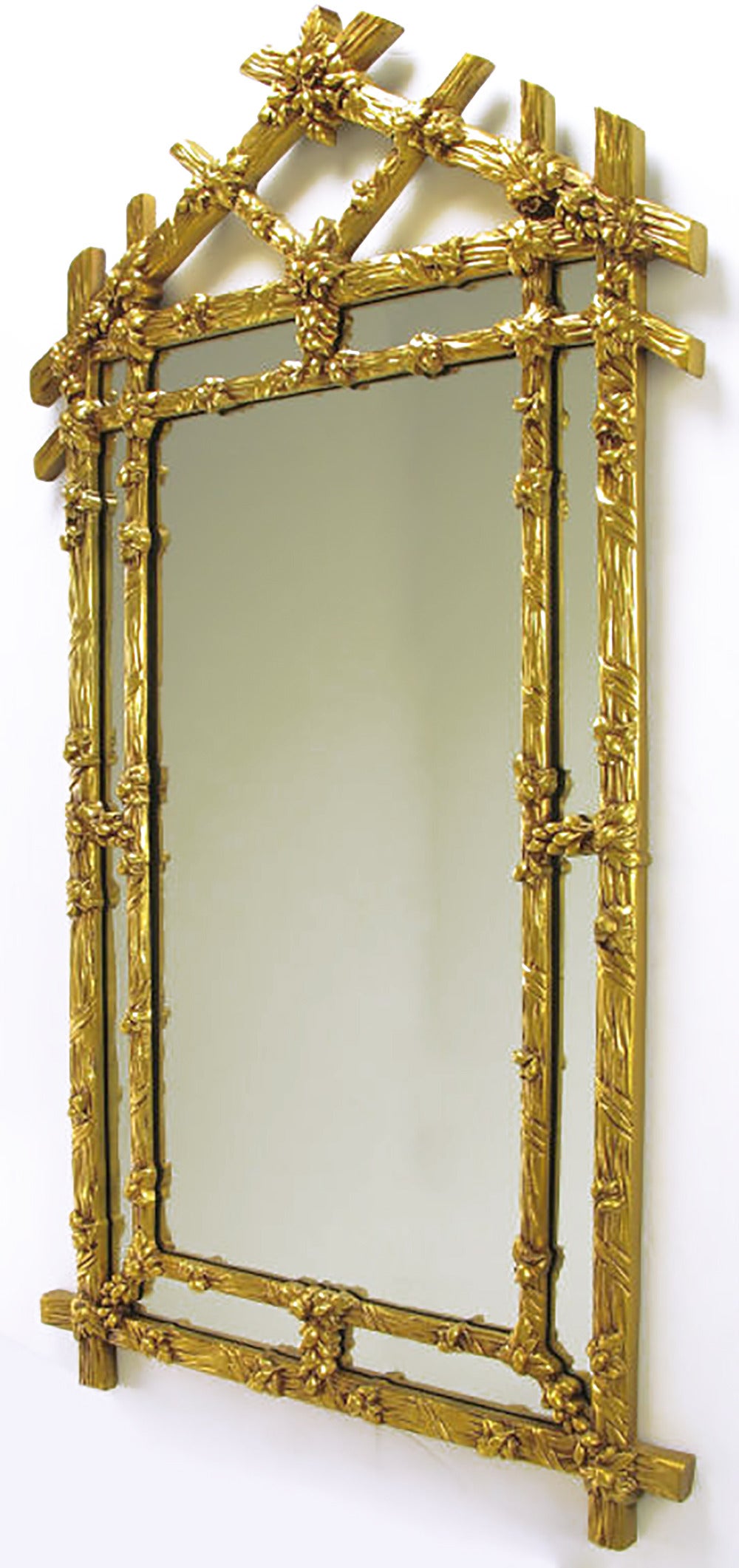 Black Forest style mirror in gilt finish with foliate detailing and segmented frame in frame. 