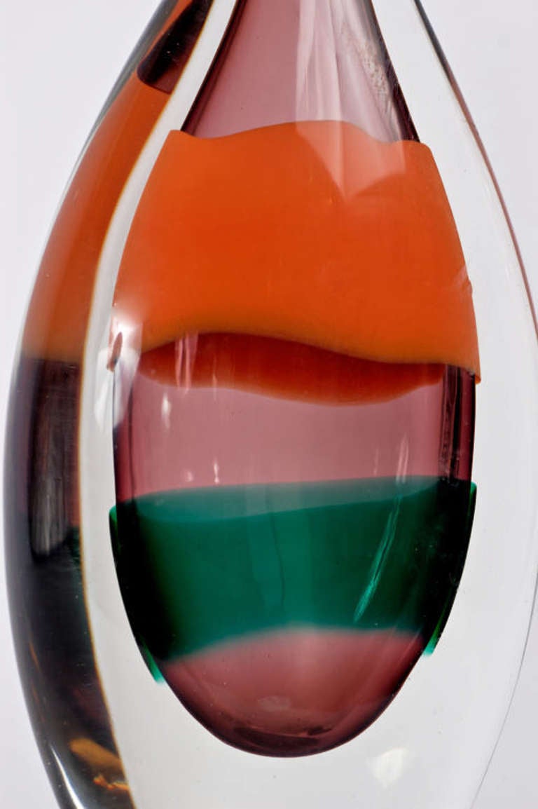Heavy Murano glass, for Salviati. Clear glass outside, amethyst inside, with orange and green stripes.