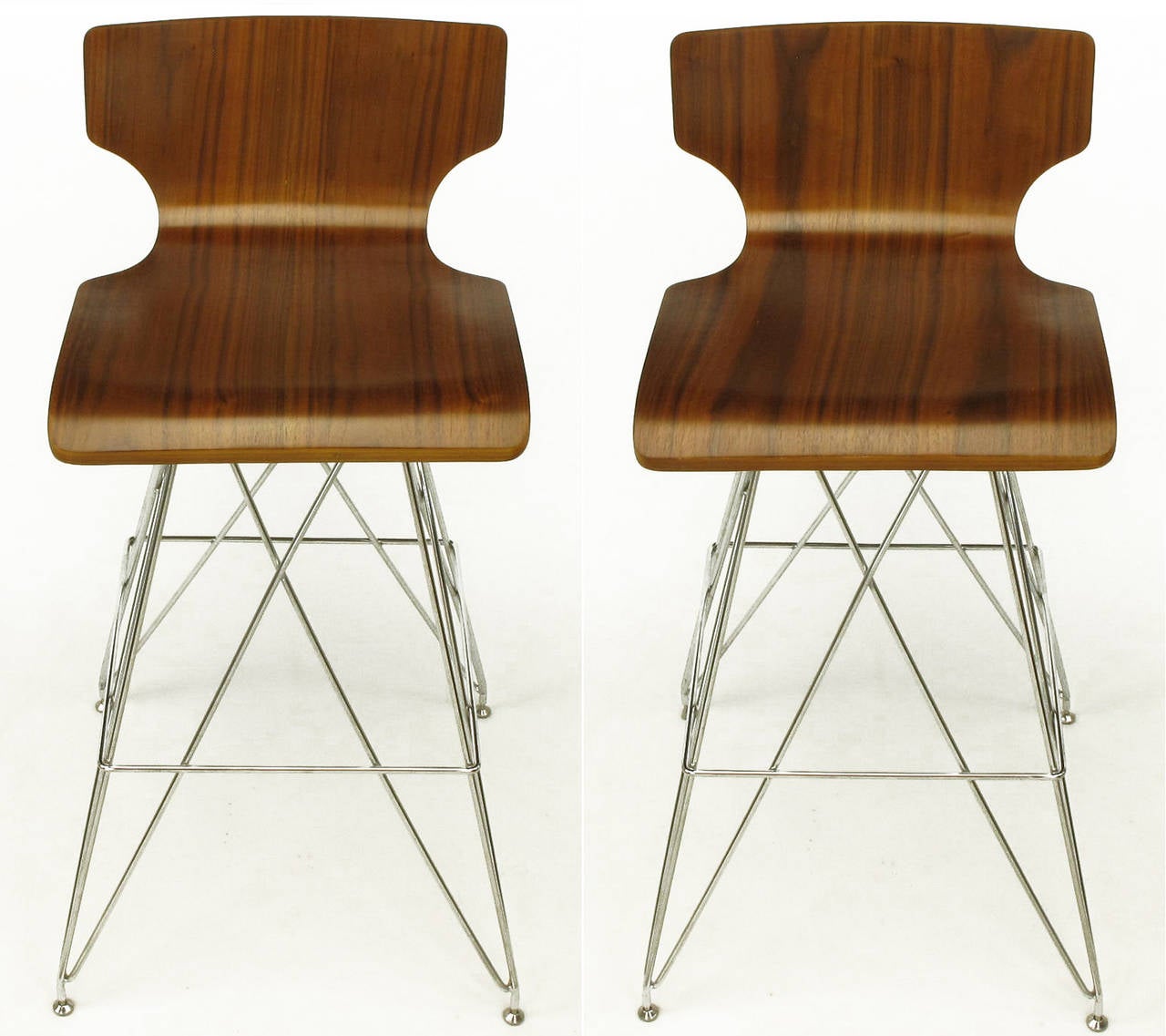 Pair of bentwood seat bar stools with figured teak veneer, low backs and chromed steel 