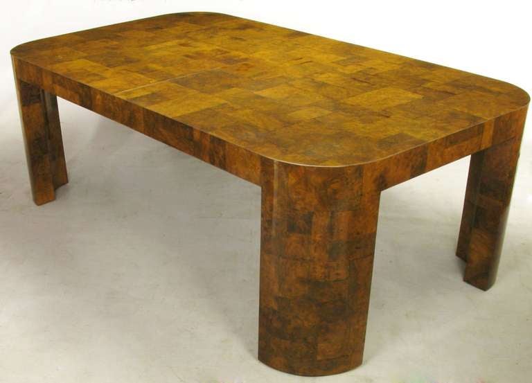 An excellent example of the modern elegance that was Paul Evans' work for Directional in the late 1960s through the middle 1970s. This patchwork dining table in burled walnut has radius corners and legs. The fine burled walnut veneer of various