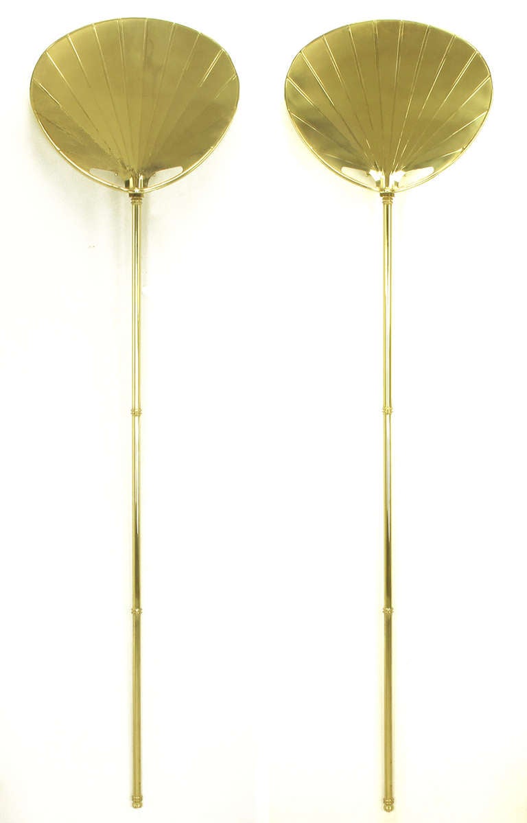 Very nice pair of chapman lighting brass back lit wall sconces in the shape of Asian fans. White lacquered backs and curved insulator distributes the light evenly around the fan. Solid brass tubing in the shape of bamboo covers the lamp cord.