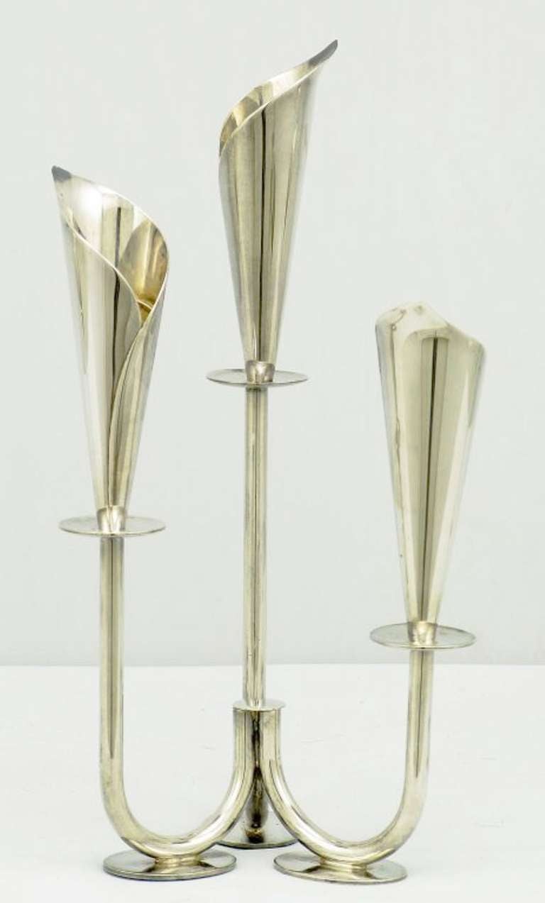 Set of three elegant art nouveau inspired candelabras. Two single light and one three light in silver plate. Stamped 