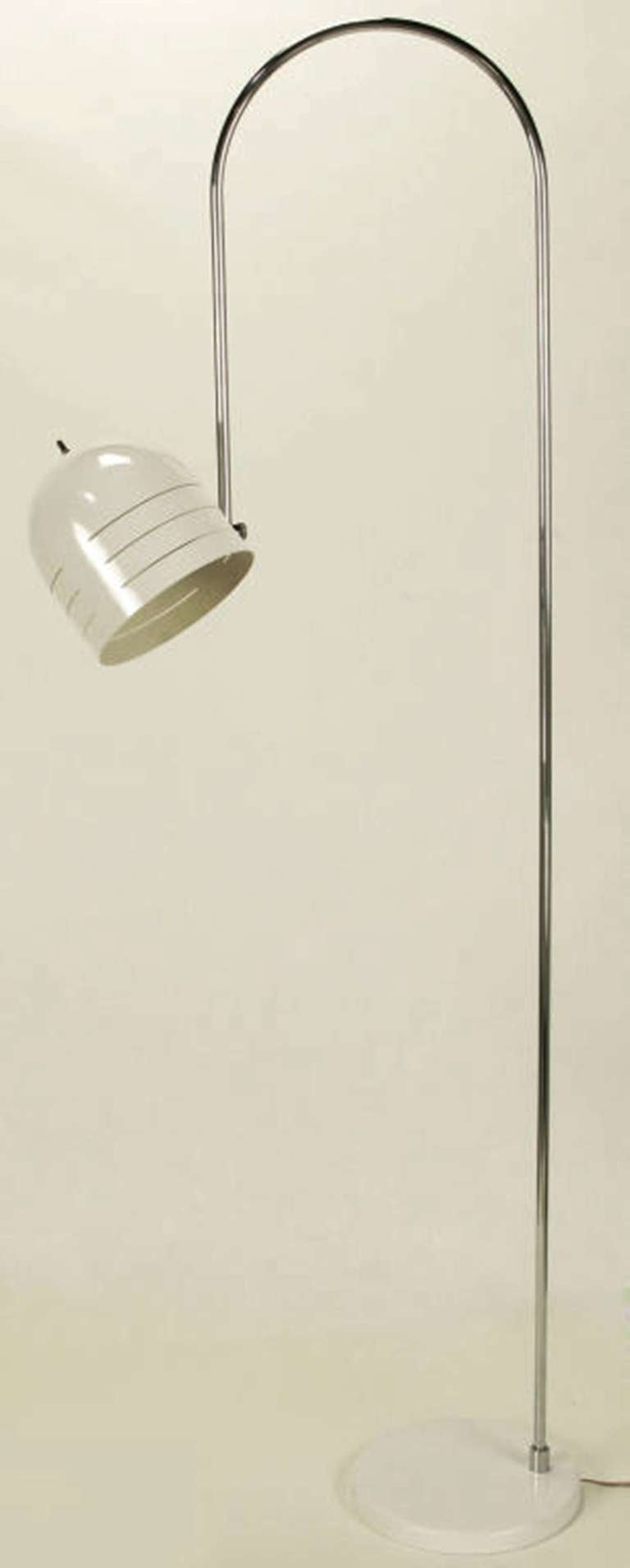Italian floor lamp, possibly a Sarfatti design, with chromed arched arm and white enameled dome shade with incised detail. Articulated ball joint and pivoting bar on arched arm. White enameled metal base.