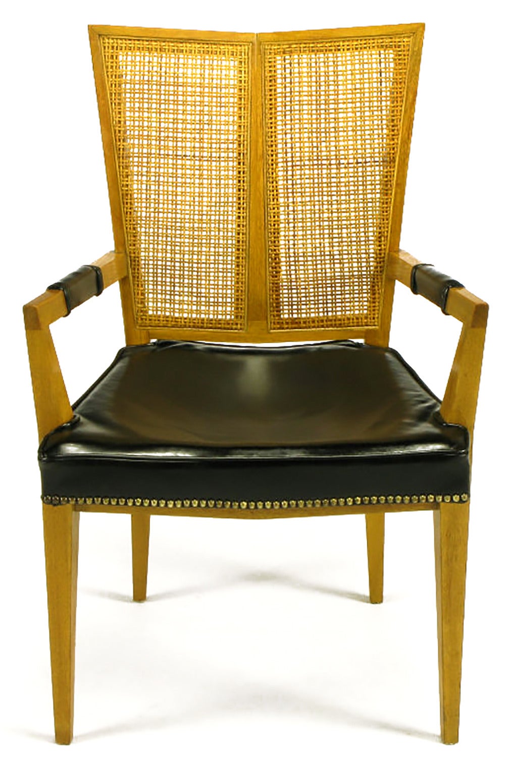 Set of six rare V-back dining chairs. Clean lines, excellent construction and unique form. Includes two arm chairs and four side chars. Each chair has a bleached walnut frame, with V-shaped two-piece cane back, leather seat with brass nail head