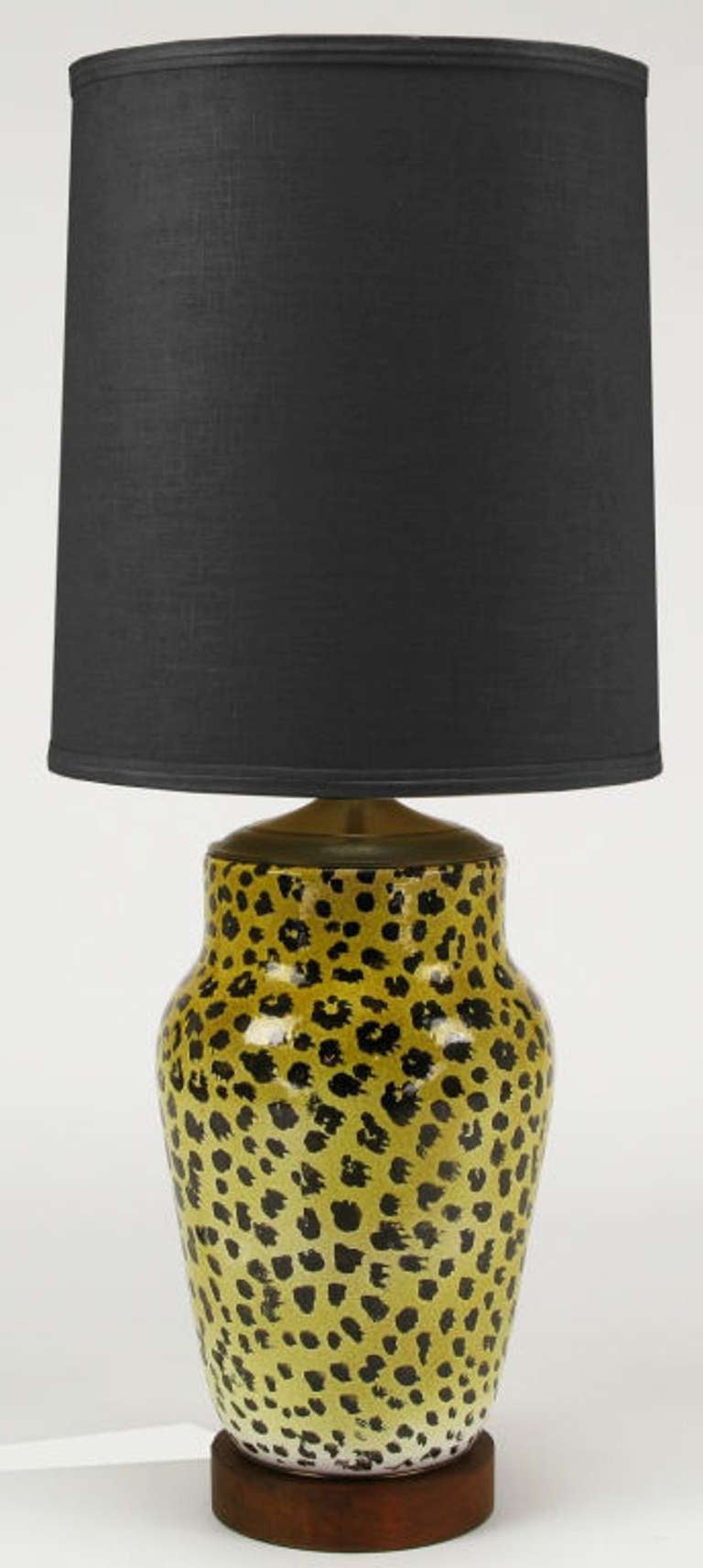 Large ginger jar shaped ceramic table lamp in leopard pattern hand glazing. Walnut wood base and patinated brass cap with original milk glass diffuser and triple socket illumination. Sold sans shade.