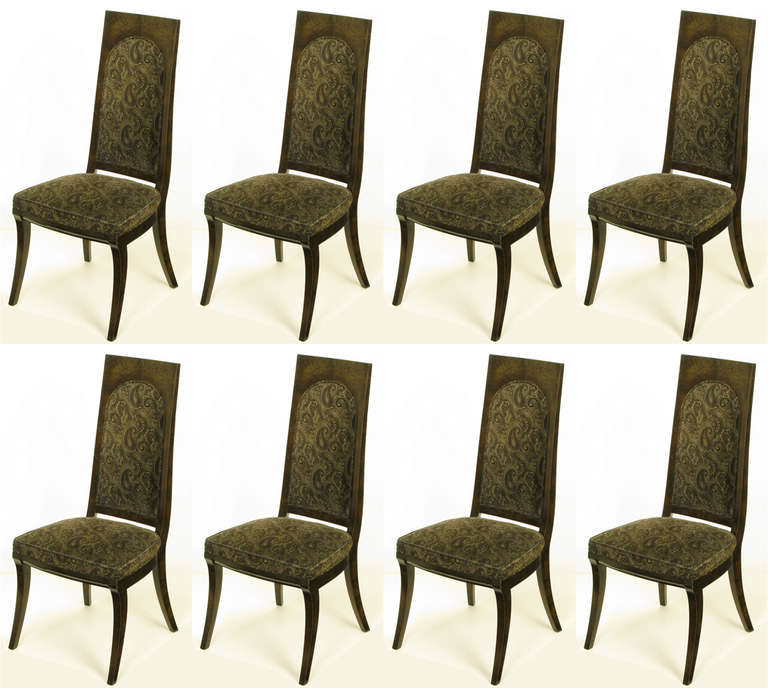 Set of eight exotic amboyna burl and dark brown with grey paisley velvet dining chairs. Klismos style legs, tall backs and ample seats create a dining chair with style as well as comfort.