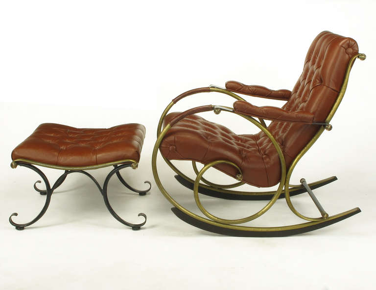 Chestnut brown button tufted leather rocking chair with matching ottoman by Lee L Woodard and Sons of Owosso, MI. Brass framed rocker is inspired by a Hoffman rocking chair from the late 1900s. Tubular hammered brass frame with sprung black