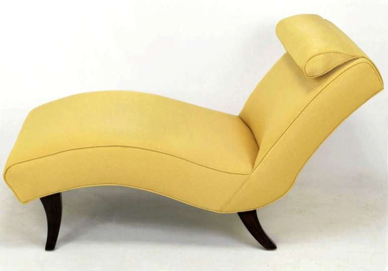 Elegant sinuous chaise longue with dark walnut saber legs, fixed headrest pillow and new yellow textured silk damask upholstery that resembles a glistening hide of leather. Perfect size for a bedroom.