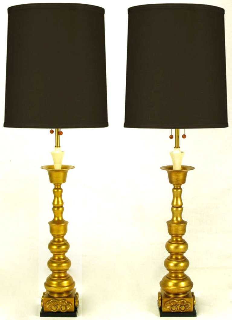 In impeccable condition, these lamps by Marbro have a black lacquered base, Asian ornamentation, and a gilt body. Complete with original black finials and renowned Marbro attention to detail.