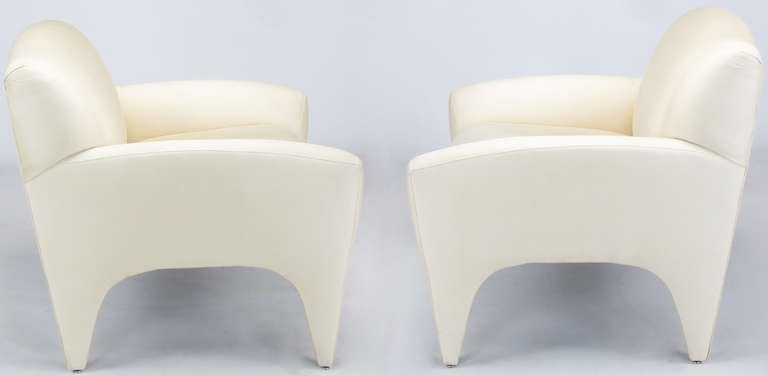 Pair of fully upholstered Art Deco inspired lounge chairs by Preview. Ivory silk upholstery, fixed cushions.