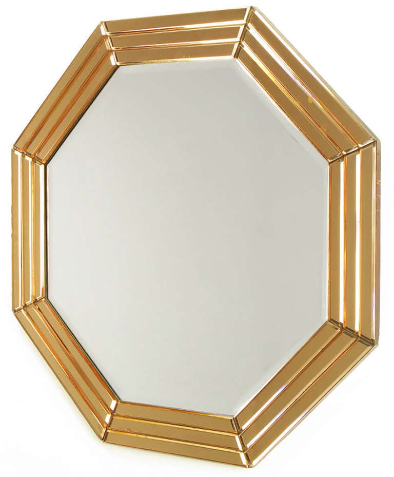 Segmented and beveled art deco style peach glazed octagonal mirror surround applied to woo with center beveled octagonal mirror.