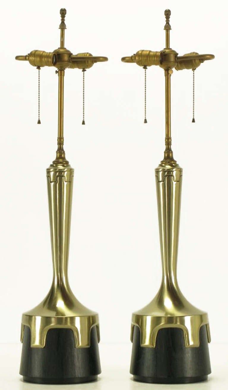 Pair of early Frederick Cooper aged nickel (not brass) and ebonized walnut table lamps. Nickel plated bodies with inverted crenellations clasping ebonized veneer bases. Incised decoration encircling the necks echoes the crenelated design. Double