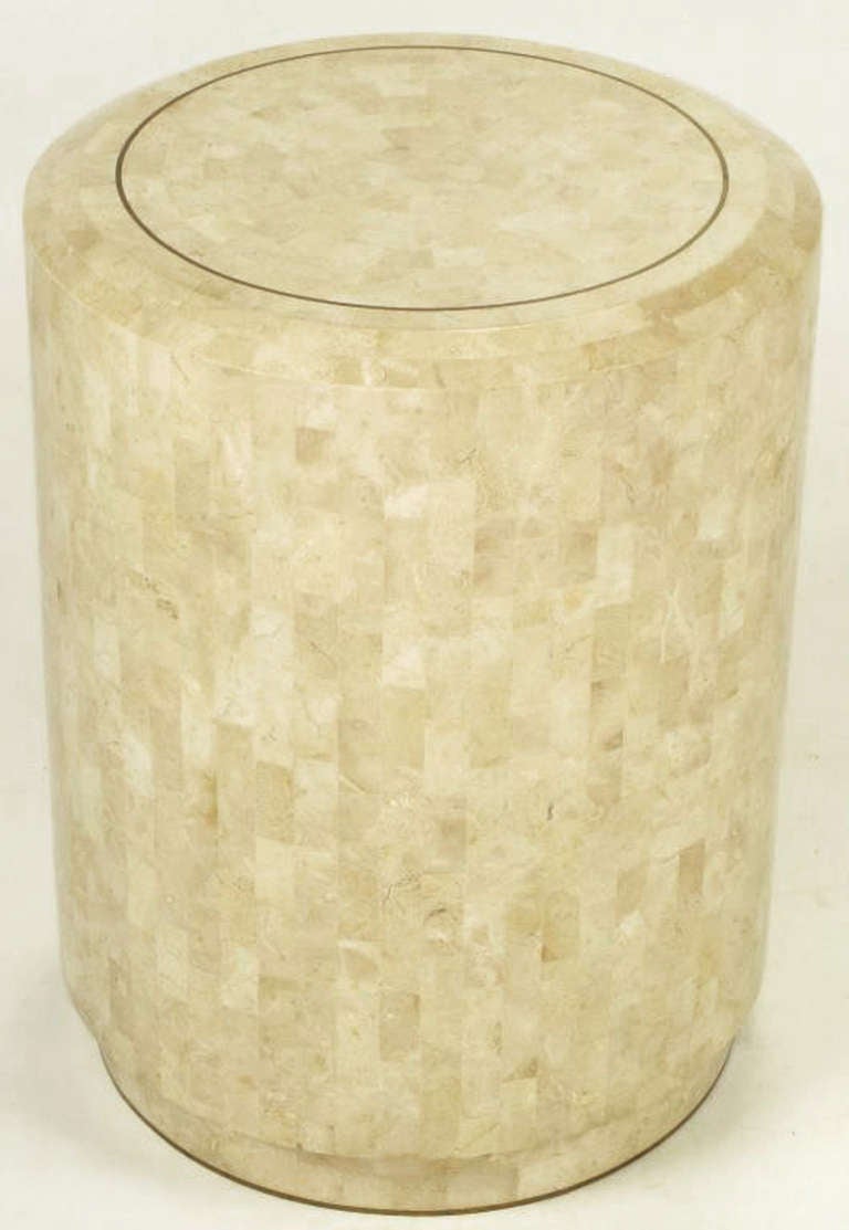 Pedestal style end tables in tessellated fossil stone over wood by Maitland Smith. Beveled edge and brass inlaid top with a recessed plinth base. Can be used as featured or with glass tops. These would also make a striking table base as well.