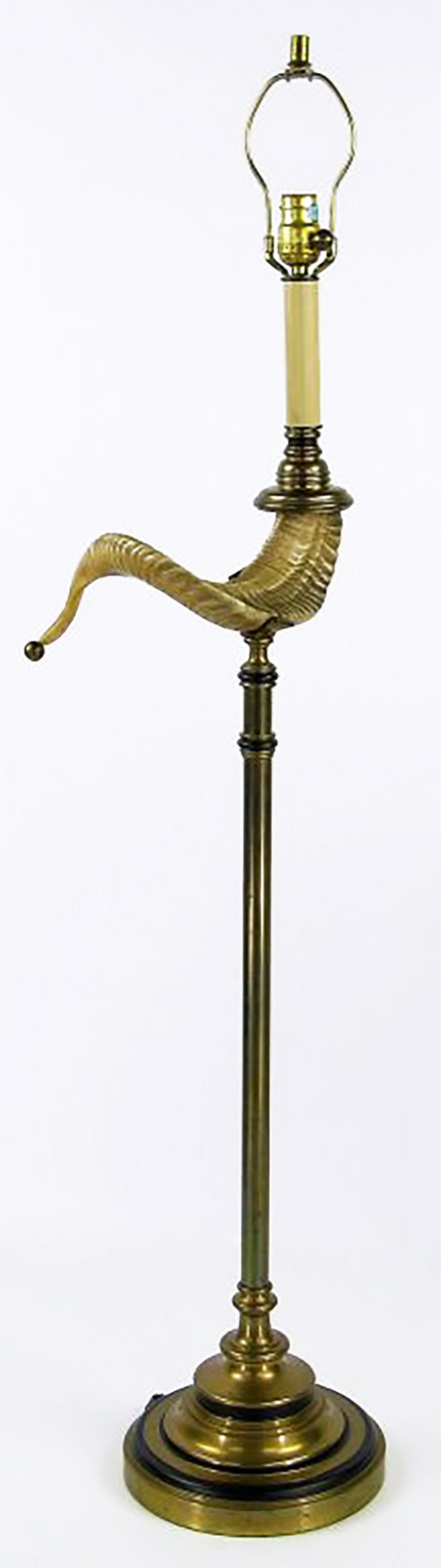 Antique brass and black lacquer base and column cradle a cast ram's Horn on this exceptional floor lamp. Complete with harlequin shade.