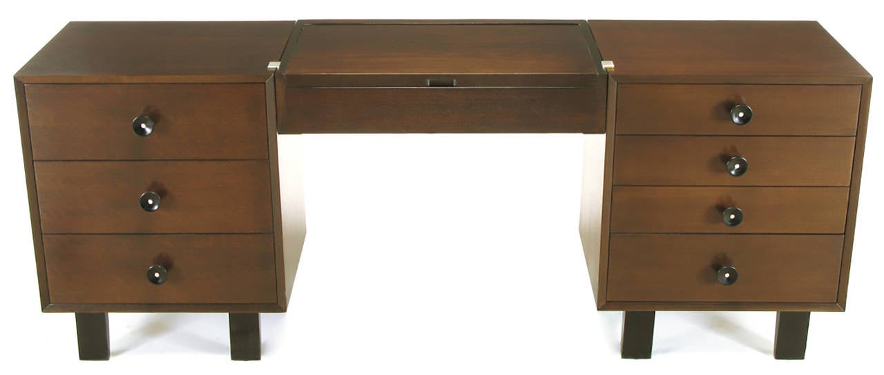 Pair of early George Nelson for Herman Miller chests or commodes with optional illuminated vanity bridge. Restored from the ground up with legs re-engineered to overcome original structural deficiencies, new 