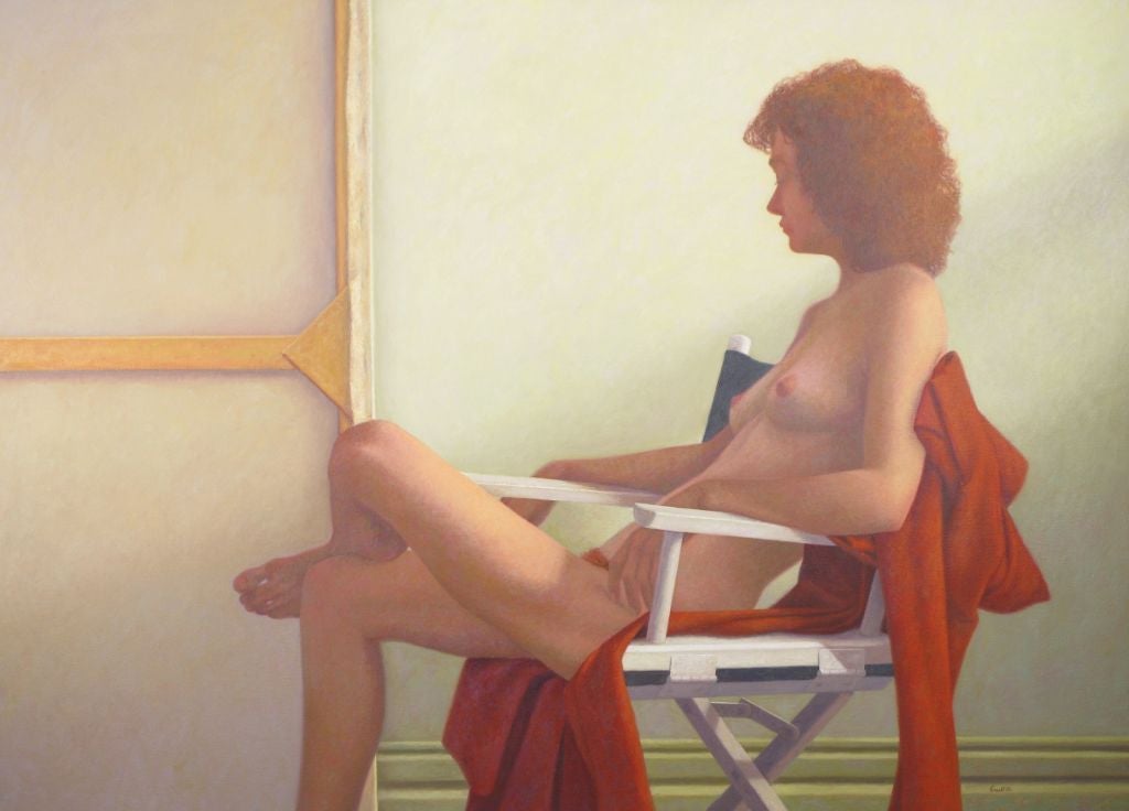 Large oil on canvas of a relaxed female nude woman with auburn hair. She is observing her likeness being painted, and peering at the reverse side of a large oil painting.  Subtle shades of celadon green and orange, in a recessed gallery style wood