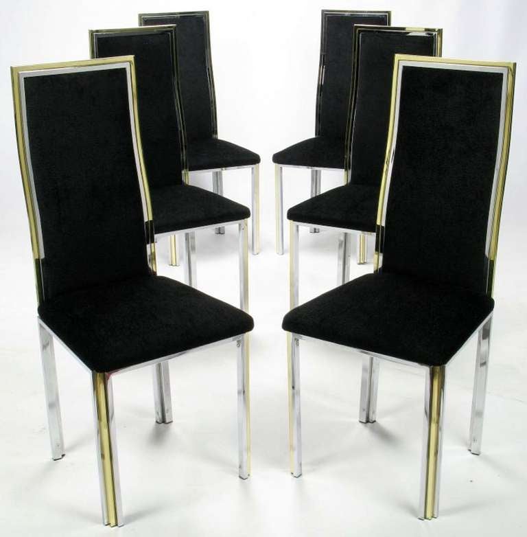 Very well crafted and comfortable dining chairs in chrome and brass frames with fresh textured black chenille upholstery. Attributed to Italian metal furniture designer Romeo Rega.