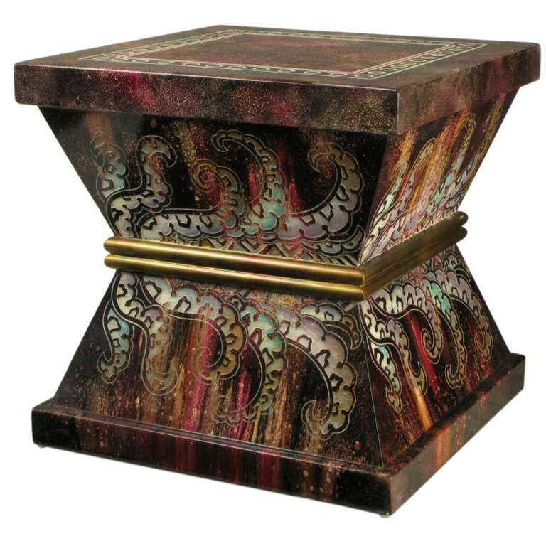 Very colorful, and much like the cast resin pieces of Phyllis Morris, this side table or pedestal sports etched and stylized paisleys, with a gilt double bar middle. The top is also etched with a square double border with internal circles. A most