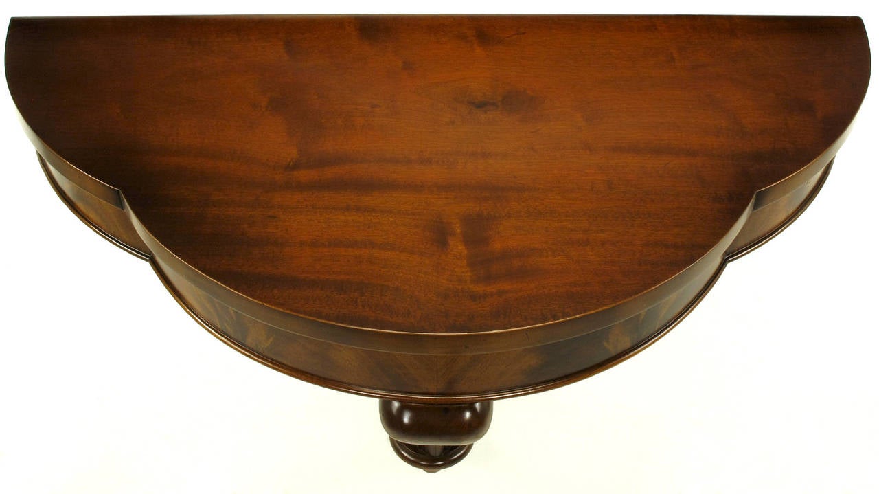 1940s Bookmatched Mahogany Demilune Wall Console with Plume Base In Excellent Condition In Chicago, IL