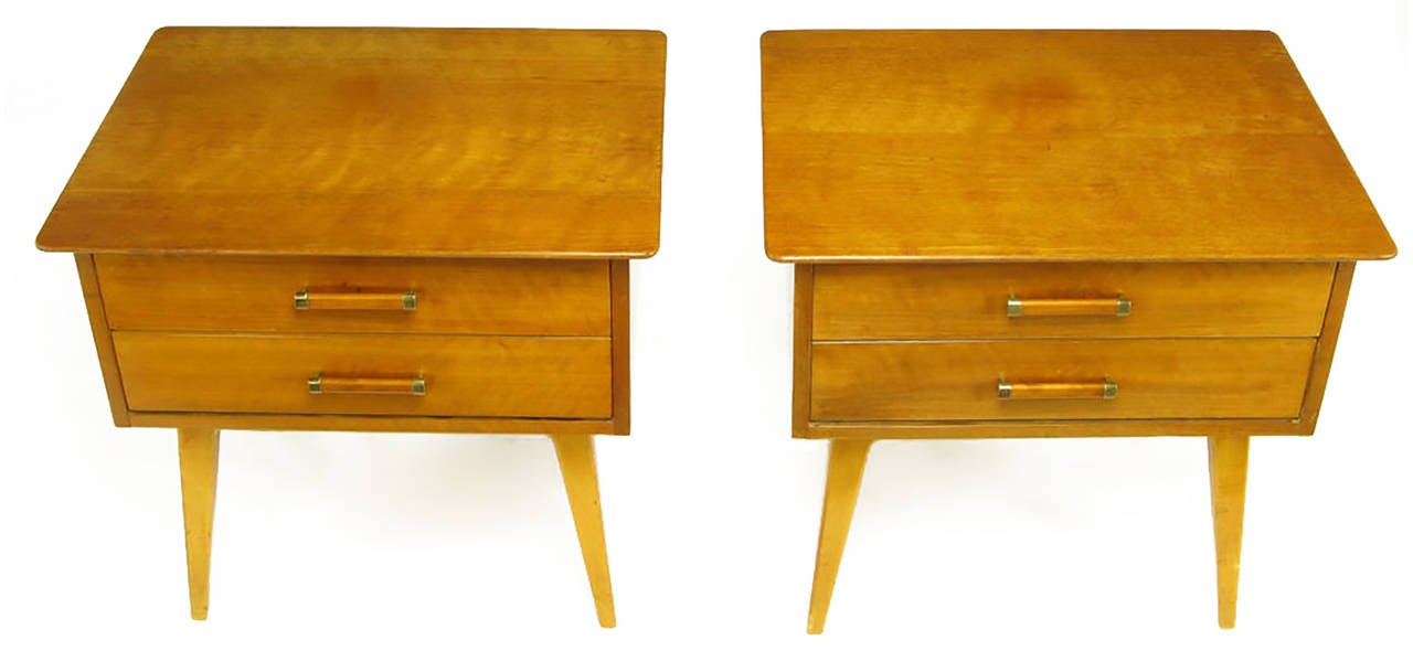 Pair of elegantly simple walnut nightstands by Renzo Rutili for Johnson Furniture. Sculptural recessed carved wood legs with walnut bar and brass end pulls. Finished on all four sides so could also be used as end tables.