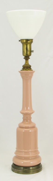 Beautiful pink ceramic baluster-form table lamps, resembling pink alacite glass, with brass bases and acanthus leaf detailed fitments. Original brass cups and milk glass diffusers. Possibly manufactured by Rembrandt or early Stiffel.