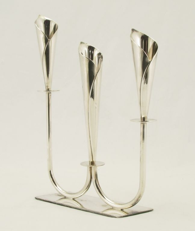 Art nouveau inspired Danish three light candelabra of stylized calla lilies on U shaped arms with a rectangular flat base. Danish silver plated metal with Denmark and Hans Jensen whale hallmark.