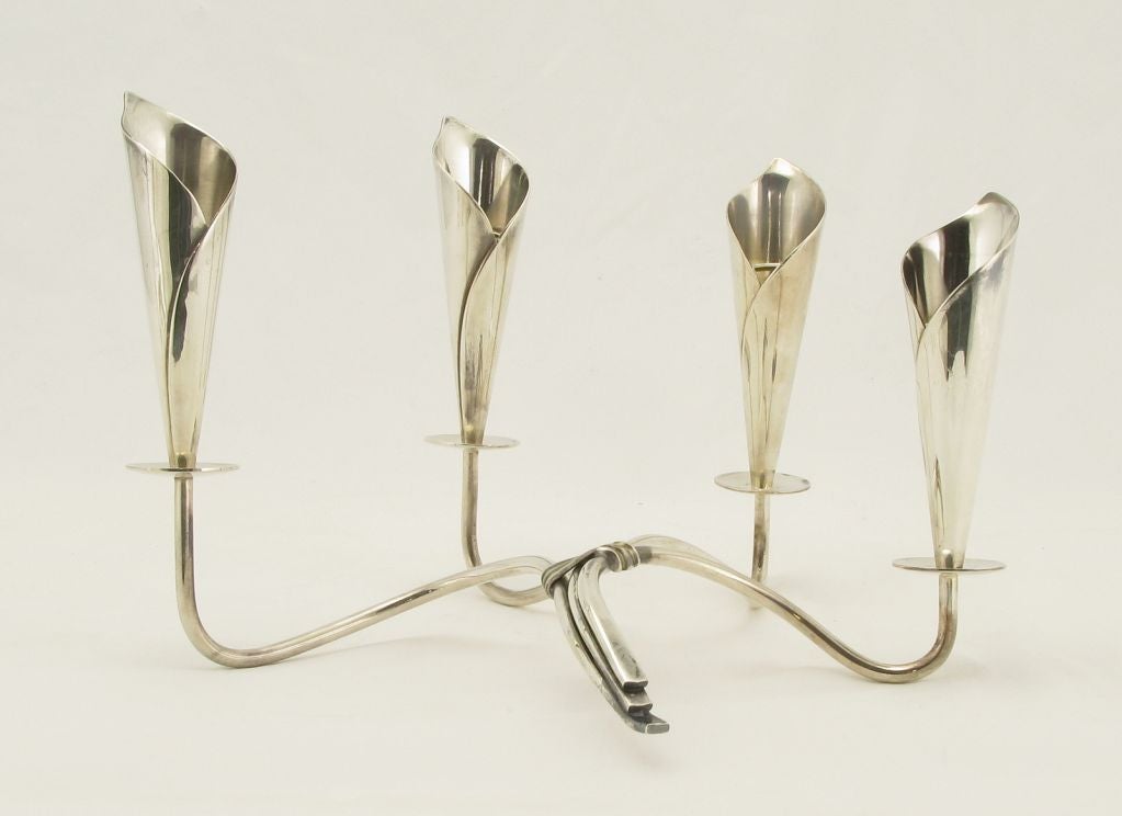 Art nouveau inspired two part Danish silver plate candelabra with stylized calla lilies. Each candelabra has four lights on sinuous arms of various lengths that are wrapped together at the center. Stamped Denmark with Hans Jensen's whale hallmark.