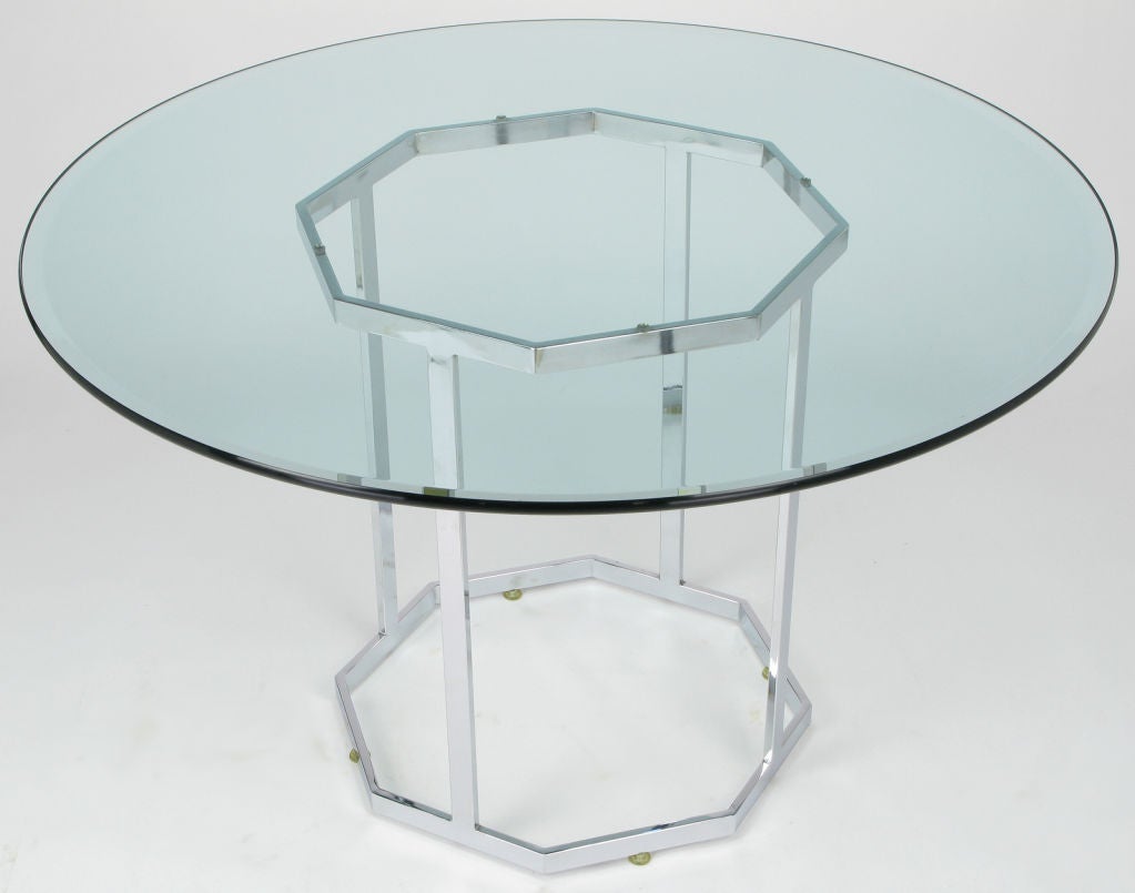 Solid chromed steel bar frame in in the shape of an open octagonal pedestal in the manner of Milo Baughman's collection for DIA. Round glass top is 3/4