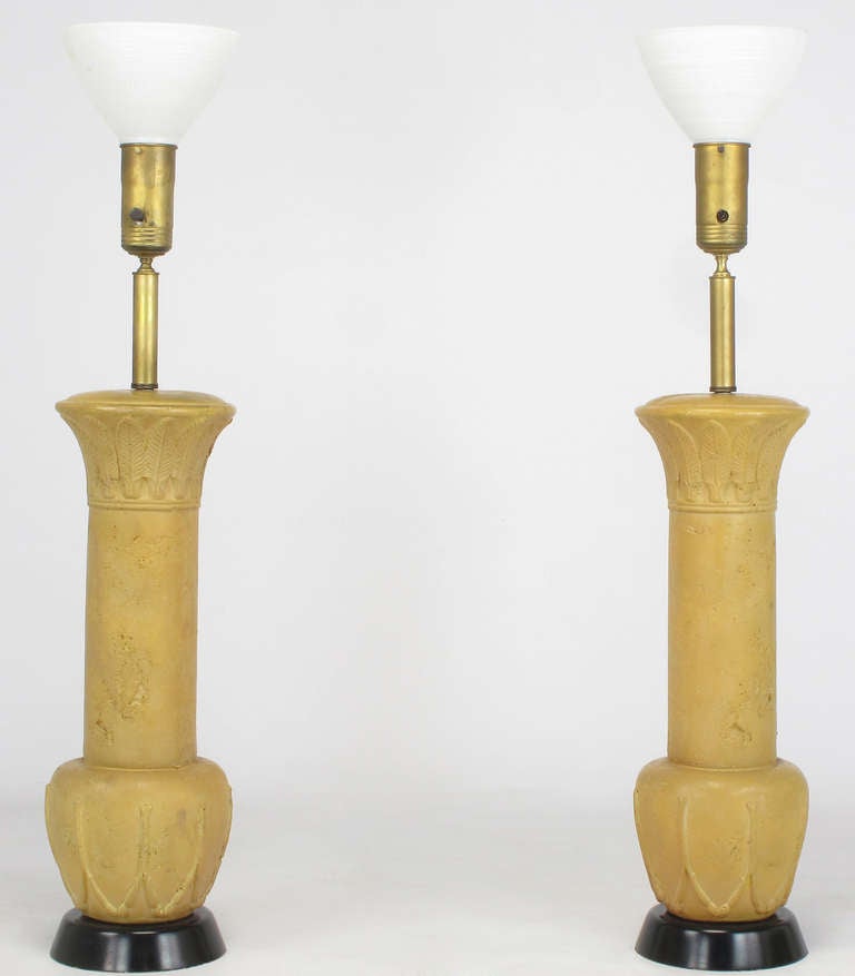 Reminiscent of some Frances Elkins design lamps, this monumental pair have terra cotta glazing over cast plaster, black lacquered plaster bases, brass stems and cups, with white milk glass diffuser.  Original shades are woven of bamboo and