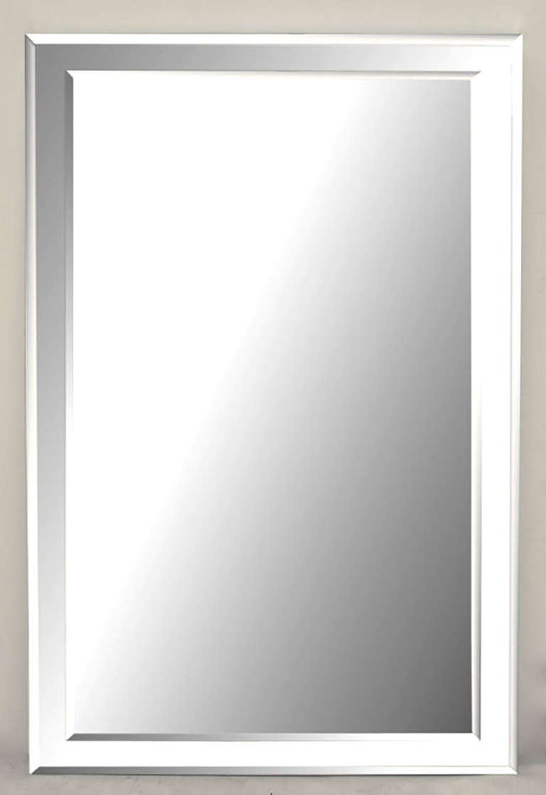 Heavy and well made, custom designed wall mirror with beveled glass mirror over a larger beveled glass mirror. Mirrored top, bottom and sides are nearly 2