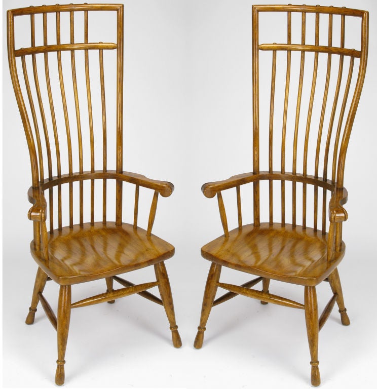 Pair of Hibriten medium tobacco stained white oak arm chairs with curved dowel form fitting back and shovel seats. Contemporary infused traditional seat backs have an exaggerated form and are through dowel constructed; drum stick styled legs are