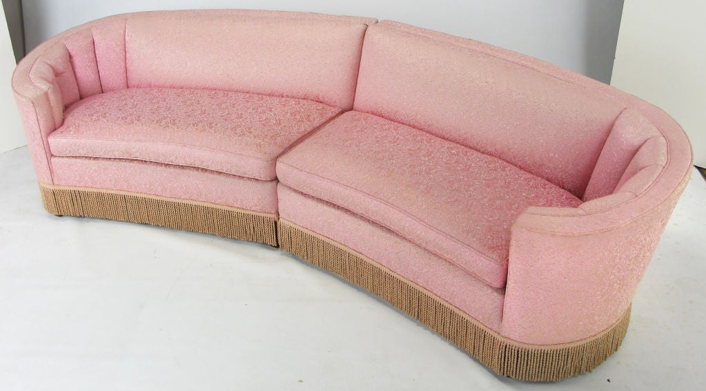 Elliptical two piece sectional sofa in original pink damask upholstery. Curved sides are channeled, also feature corded skirting. Tapered square walnut legs are perfect for a skirtless look as well.