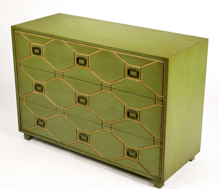 From Draper's Viennese Collection for Henredon, this striking mahogany chest retains its amazing and original celadon green lacquer finish. 
The front is decorated in a geometric cavo-relievo, with the incised lines lacquered in cream with a gold