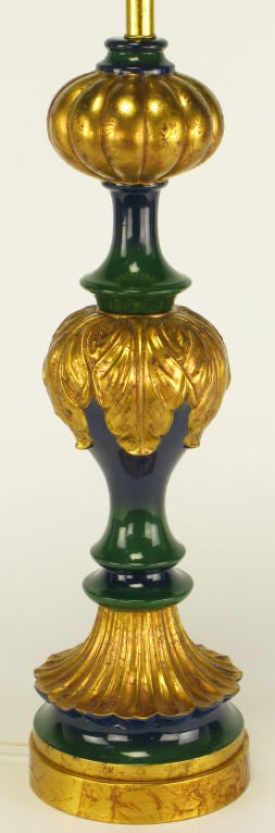 Substantial glazed ceramic bodied table lamp with segmented aged parcel gilt acanthus leaf and gourd form details and base. The remaining segments are glazed in a blue fading to green finish. Sold with custom linen blue, green and gilt ribbon shade.