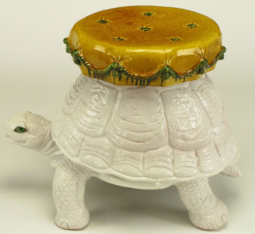 Colorfully hand painted and glazed ceramic turtle garden seat or table. White glazed tortoise with corded and tasseled green and heathered umber ceramic back pillow.