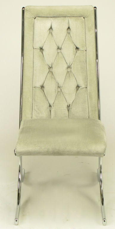 Set of four chromed metal and gray diamond button tufted velvet dining chairs by the Howell Co., a Geneva, Illinois manufacturer of chrome metal furniture, most famous for its art deco designs by Wolfgang Hoffman. Howell closed operations in the