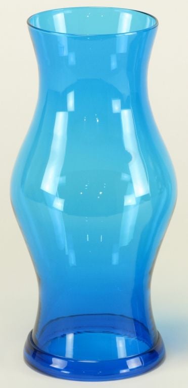 Pair of vivid royal blue glass hurricane candle shades with lipped bottom.