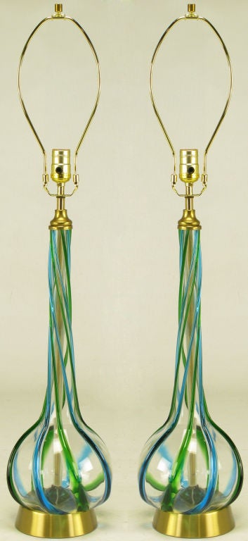 Pair of Italian Murano glass long stem gourd form table lamps. Hand blown and twisted with relief ribbon in blue and green. Spun brass base with brass stem, harp and socket.