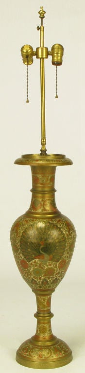 Vase form brass table lap with incised design and hand painted lacquer details. Center peacock and floral painted detailing over etched brass. Sold sans shade.