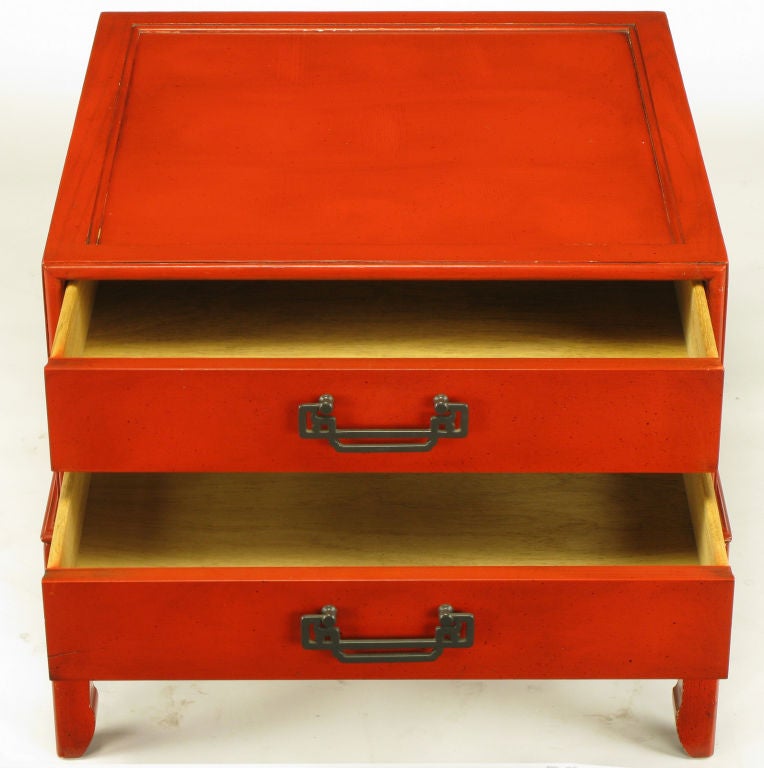 Hekman Furniture two drawer side table in cinnabar lacquer with black glazed finish. Recessed top and the appearance of a two drawer case mounted on a Ming style leg open fretwork and bracketed base. Patinated brass drop U shaped Asian pulls.