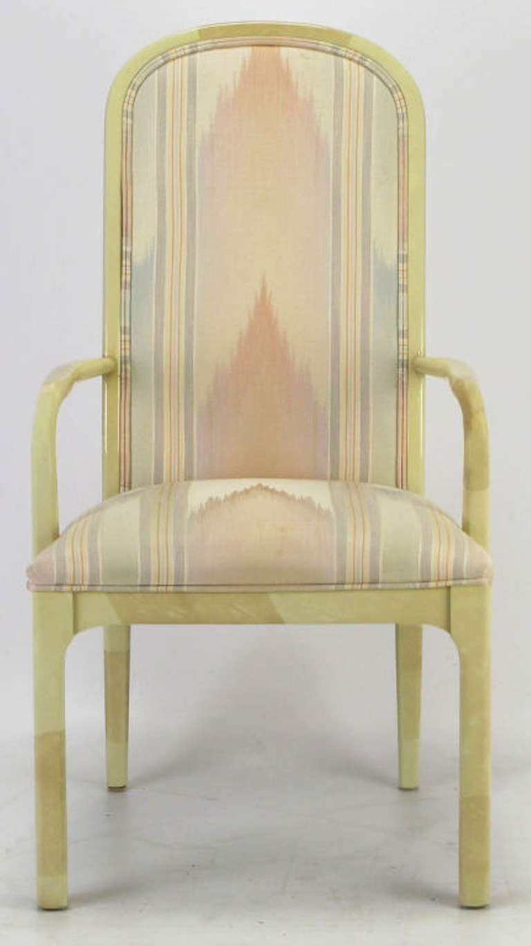 Set of six dining chairs with two arm chairs and four side chairs from Century Chair Company. Pastel flame stitch upholstery is original, and in great condition. Extremely well made hardwood chairs lacquered in an ivory faux goat skin finish.